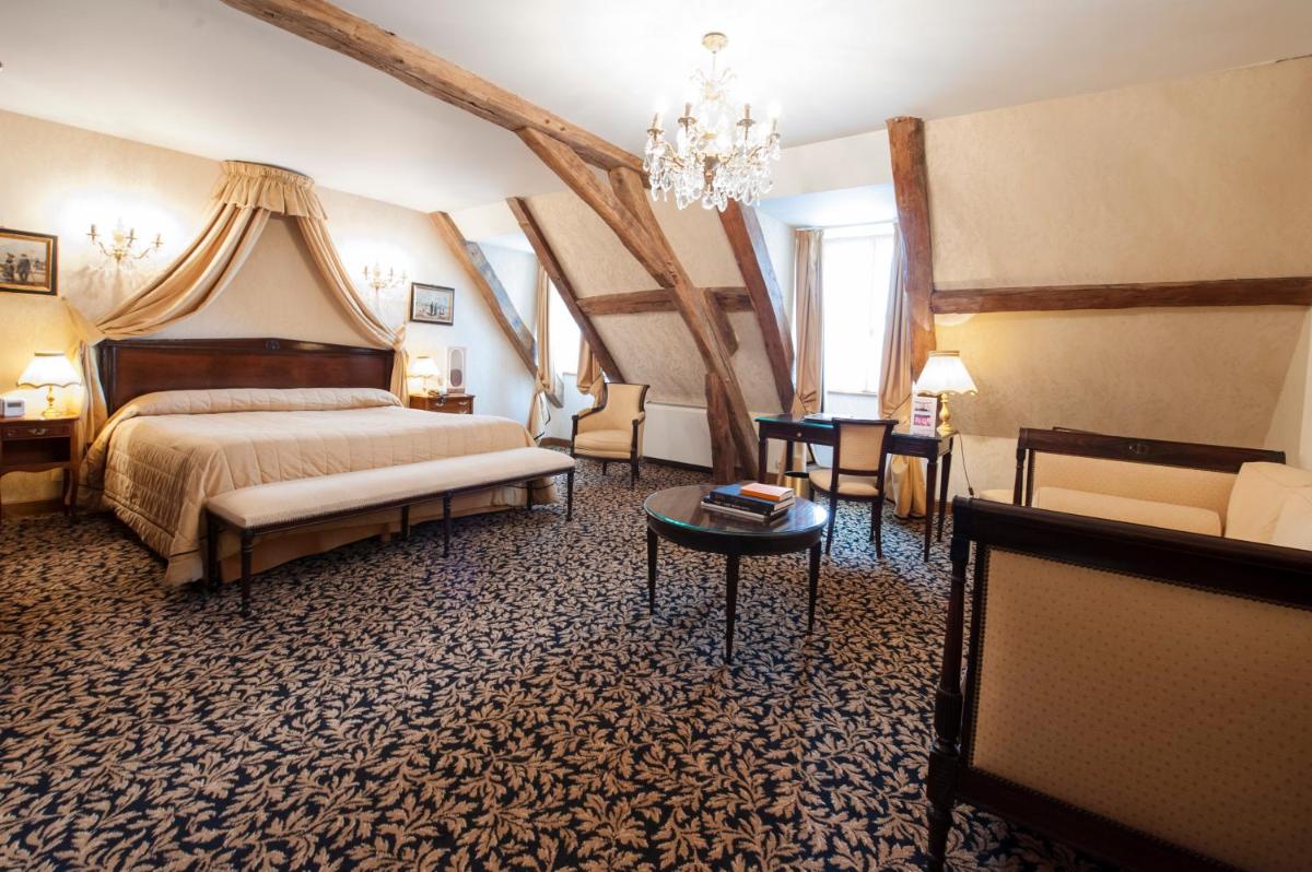 Un ou plusieurs lits dans un hébergement de l'établissement Hôtel Le Cep & Spa