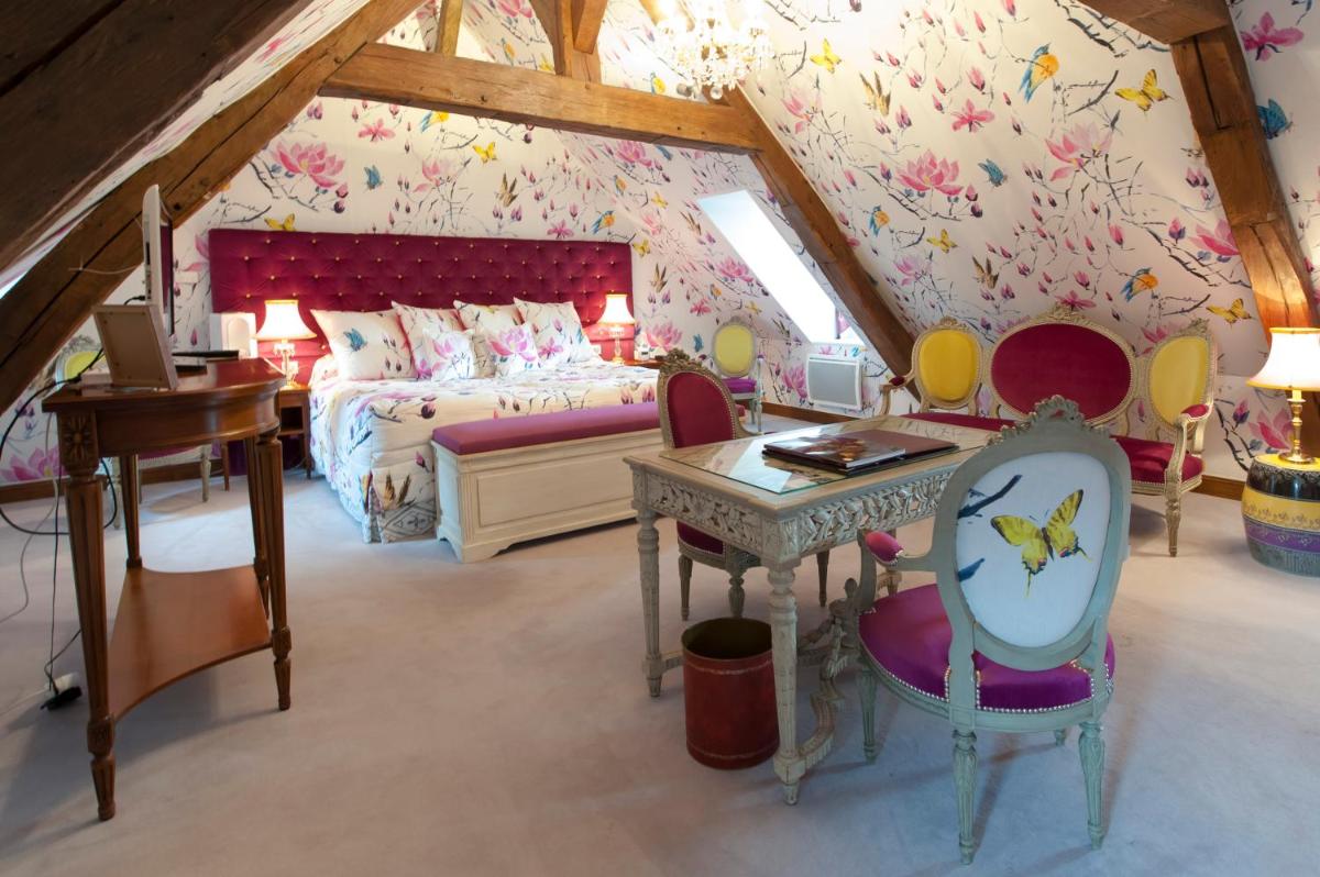 Coin salon dans l'établissement Hôtel Le Cep & Spa
