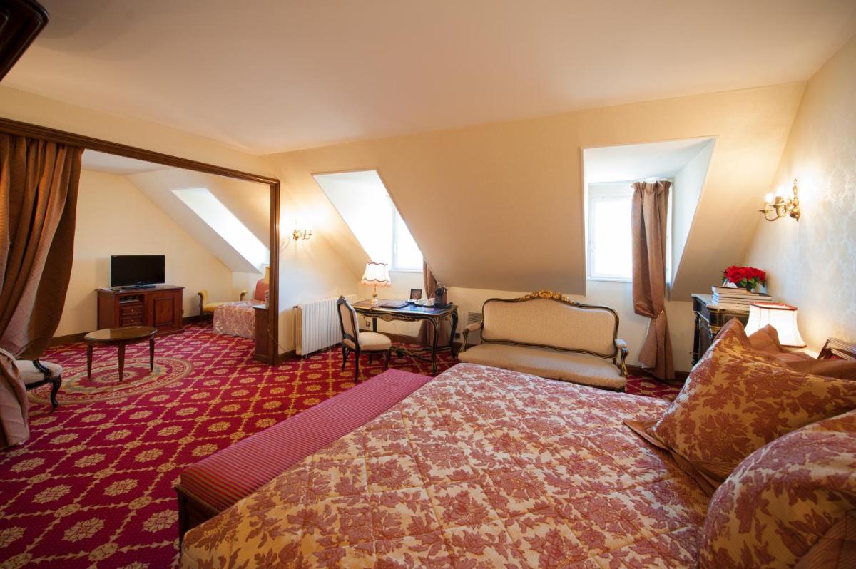 Un ou plusieurs lits dans un hébergement de l'établissement Hôtel Le Cep & Spa