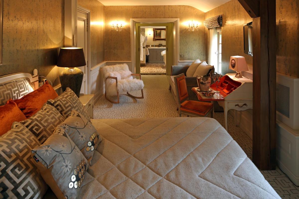 Un ou plusieurs lits dans un hébergement de l'établissement Hôtel Le Cep & Spa