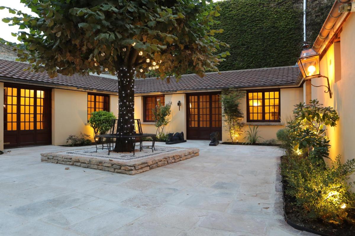 Jardin de l'établissement Hôtel Le Cep & Spa