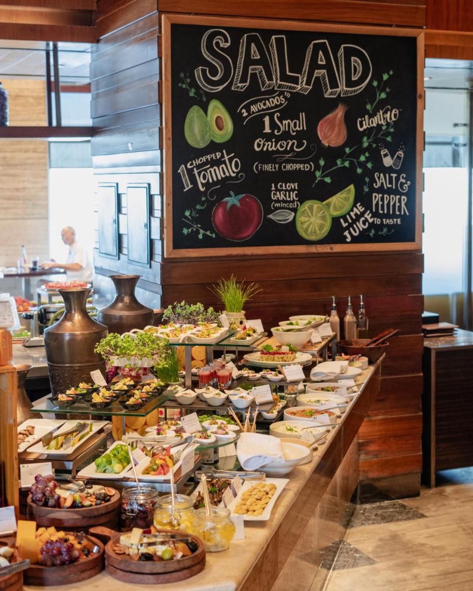 a buffet line with many different types of food at Hilton Chennai in Chennai