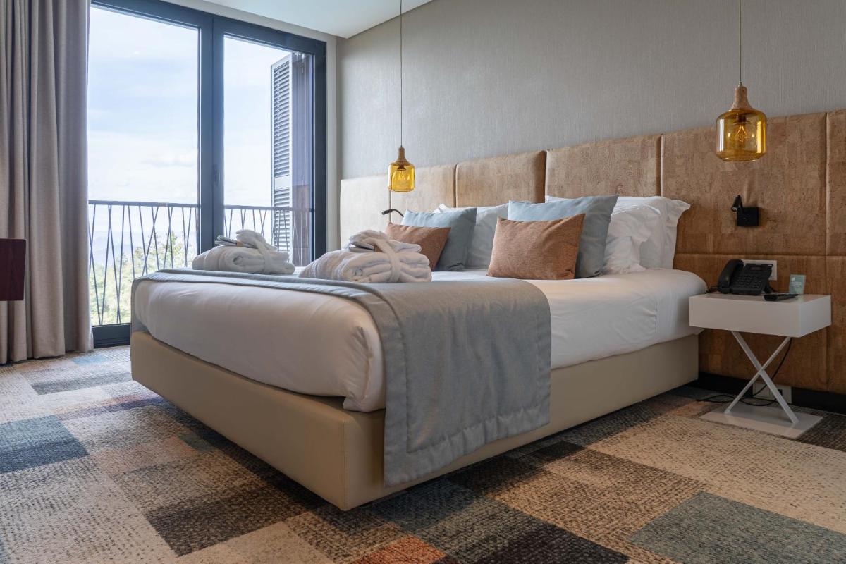 Uma cama ou camas num quarto em Pena Park Hotel