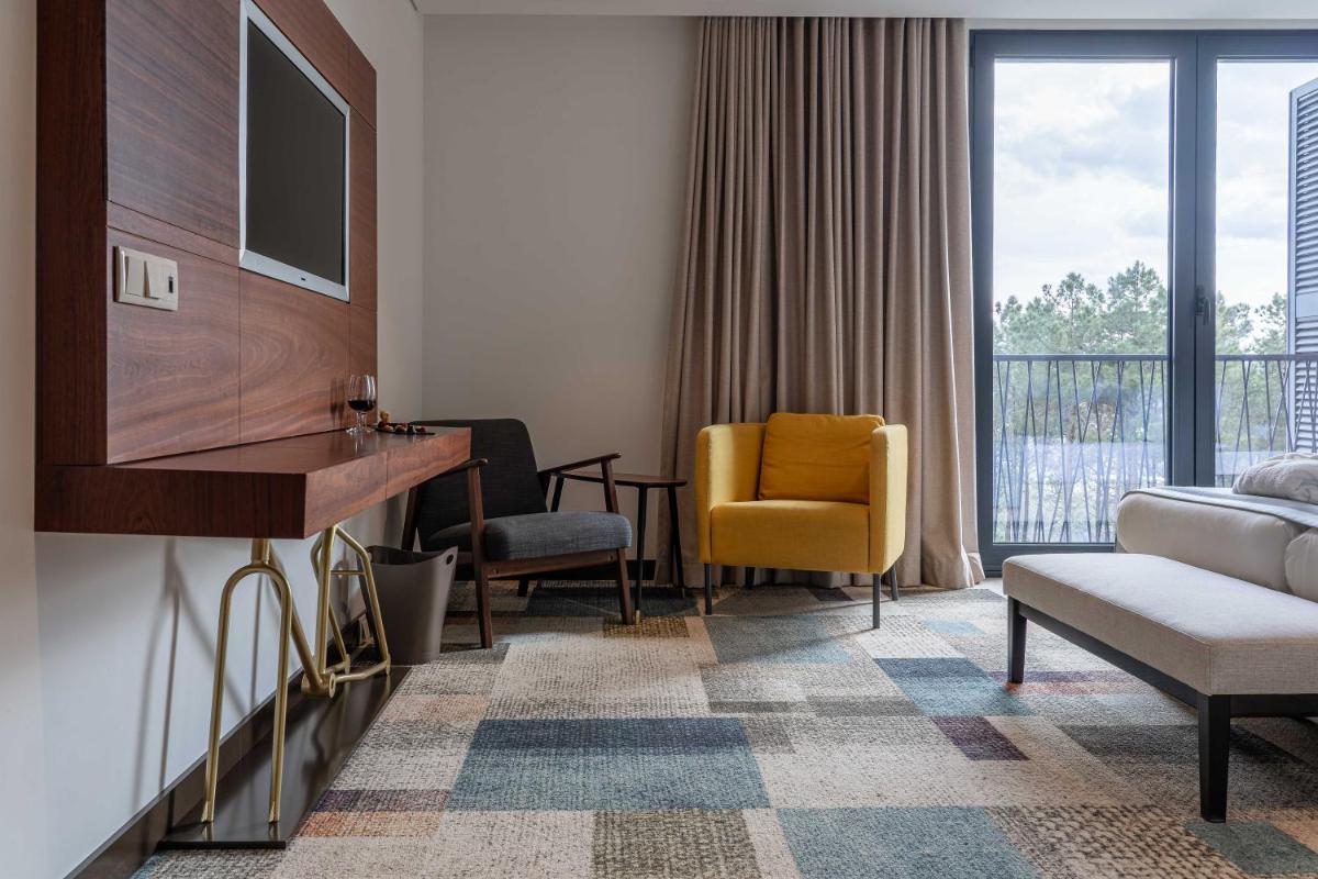 Uma área de estar em Pena Park Hotel
