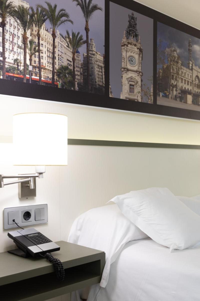 Cama o camas de una habitación en Primus Valencia