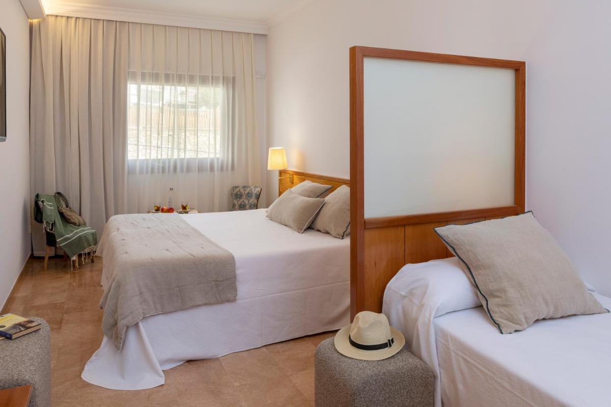 Cama o camas de una habitación en Hotel Spa Porto Cristo