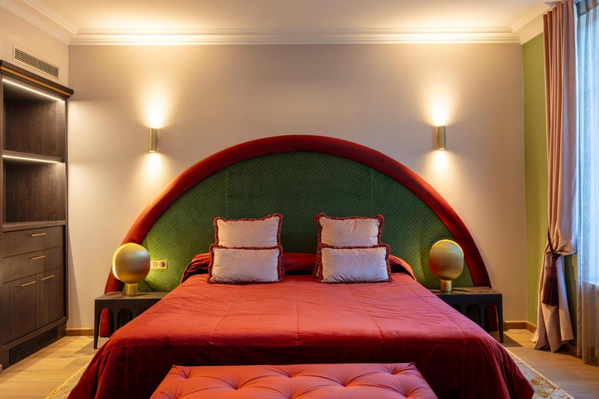 Un ou plusieurs lits dans un hébergement de l'établissement Hôtel Le Cep & Spa