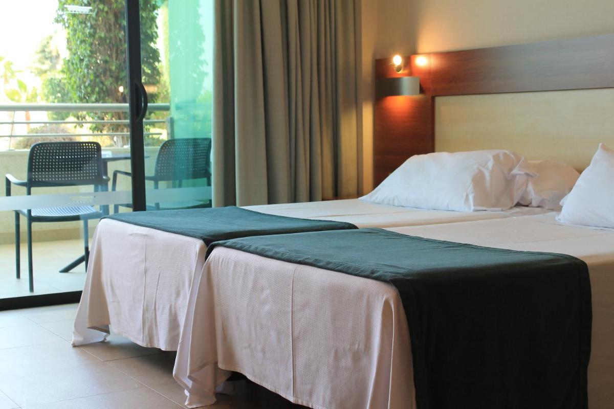 Cama o camas de una habitación en Hotel Deloix 4* Sup