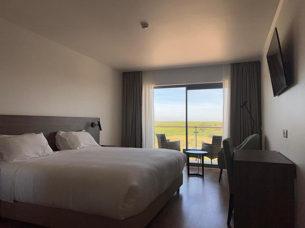 Uma cama ou camas num quarto em Hotel O Gato & Spa
