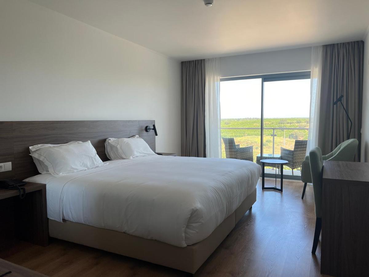 Uma cama ou camas num quarto em Hotel O Gato & Spa