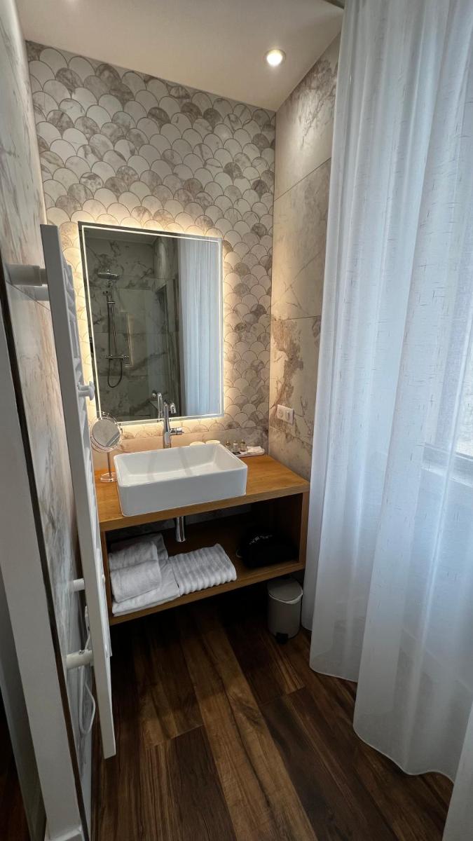 Salle de bains dans l'établissement Hôtel Casale Olmia