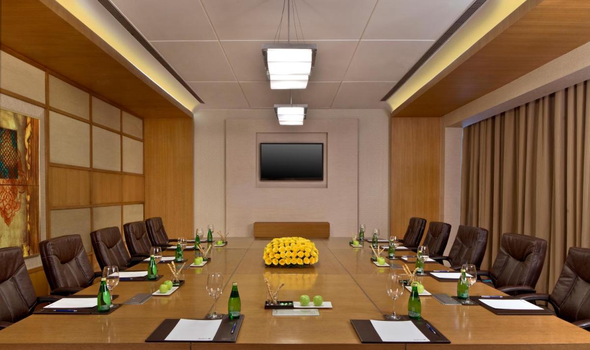 a large conference room with a long table and chairs at Taj Agra in Agra