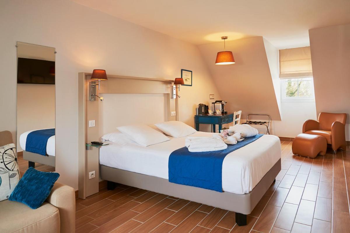 Un ou plusieurs lits dans un hébergement de l'établissement Hotel Spa Les Saules