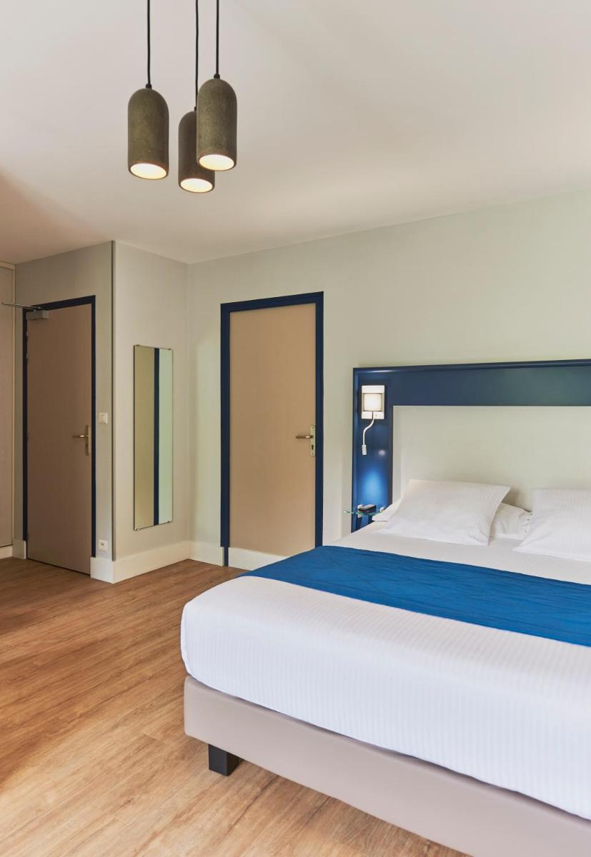 Un ou plusieurs lits dans un hébergement de l'établissement Hotel Spa Les Saules