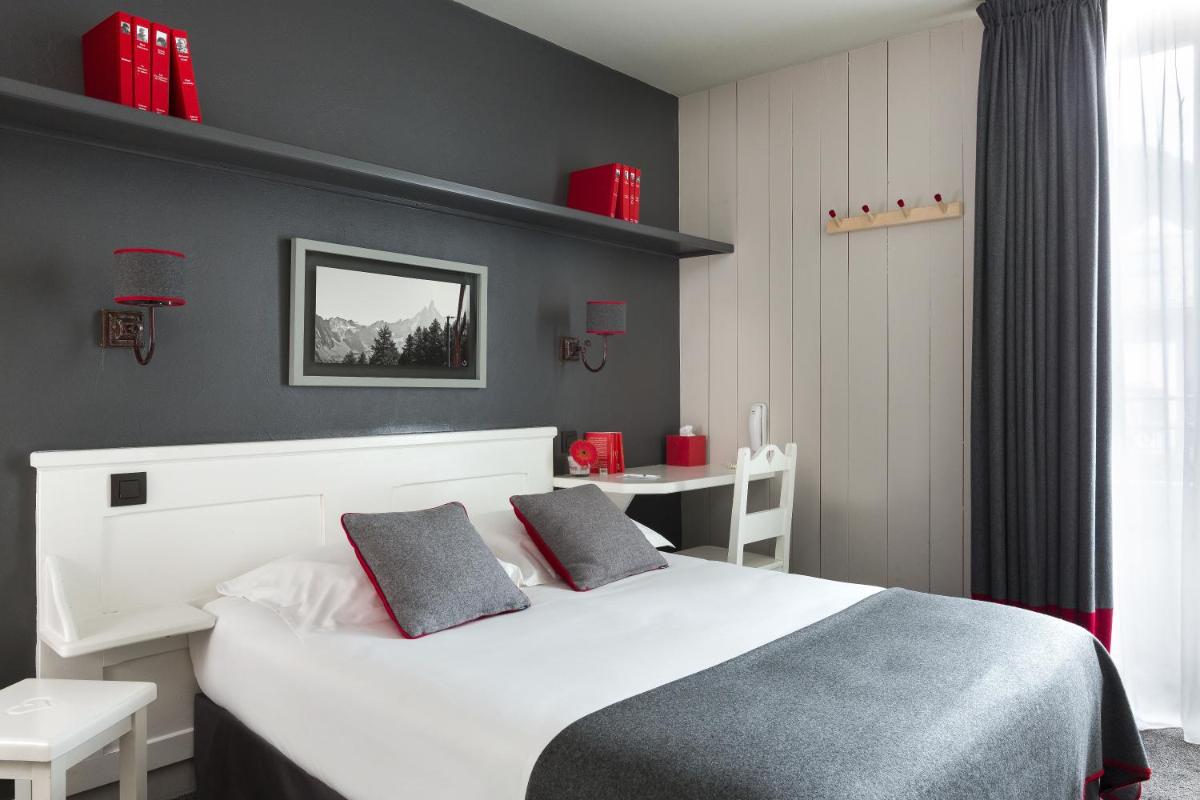 Un ou plusieurs lits dans un hébergement de l'établissement Le Faucigny - Hotel de Charme & SPA