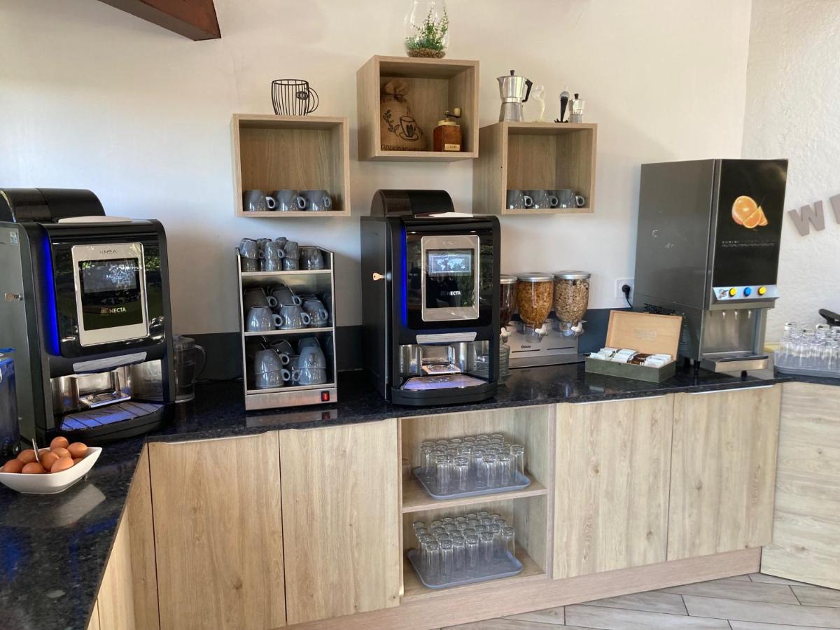 Cuisine ou kitchenette dans l'établissement Hôtel Spa L'Ermitage