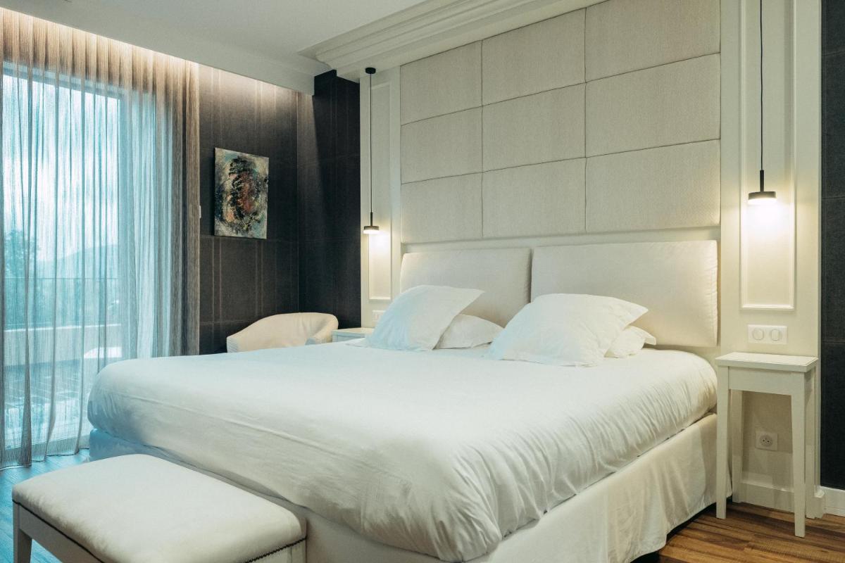Un ou plusieurs lits dans un hébergement de l'établissement Hôtel Casale Olmia
