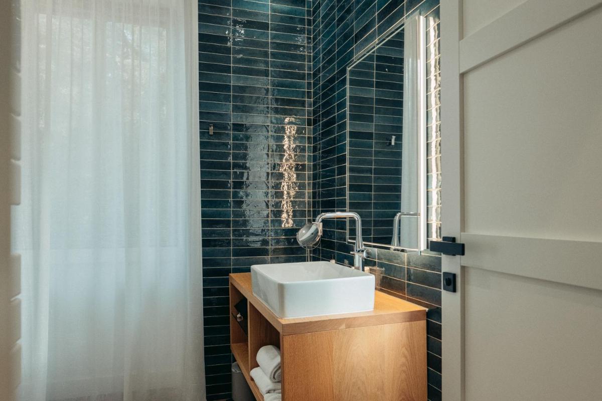 Salle de bains dans l'établissement Hôtel Casale Olmia