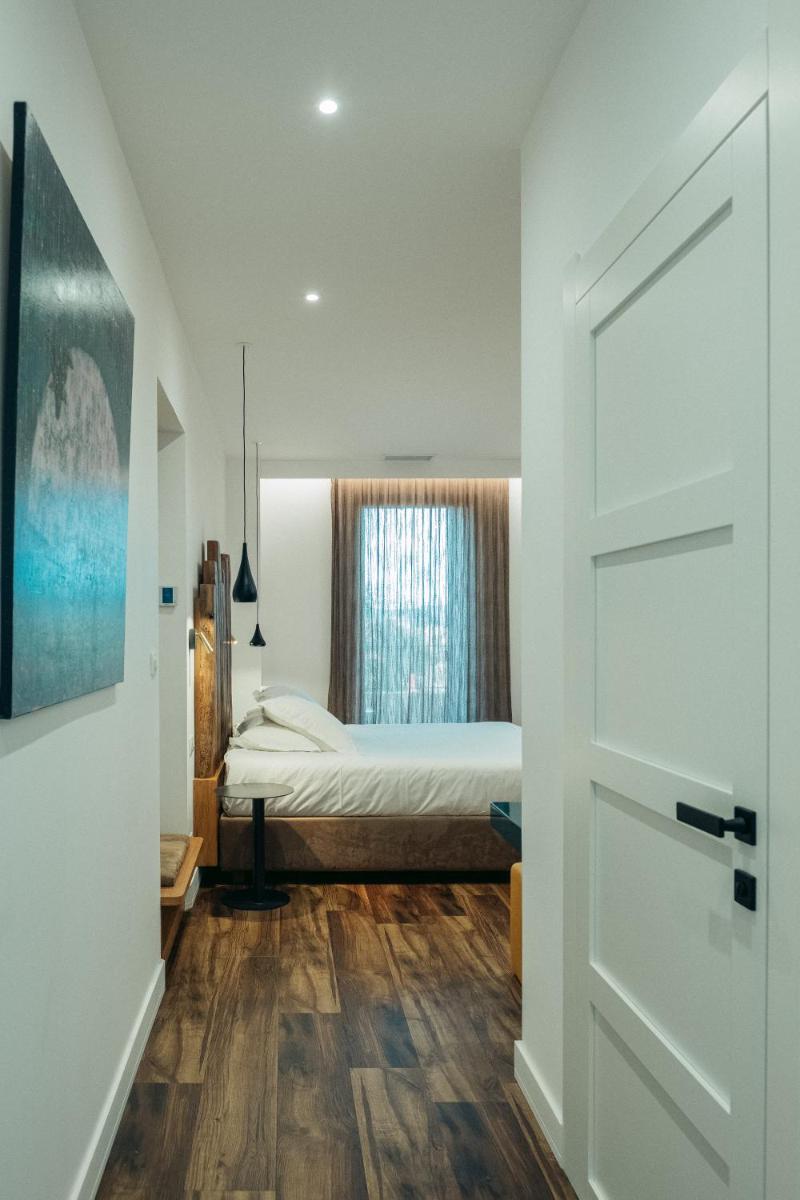 Un ou plusieurs lits dans un hébergement de l'établissement Hôtel Casale Olmia