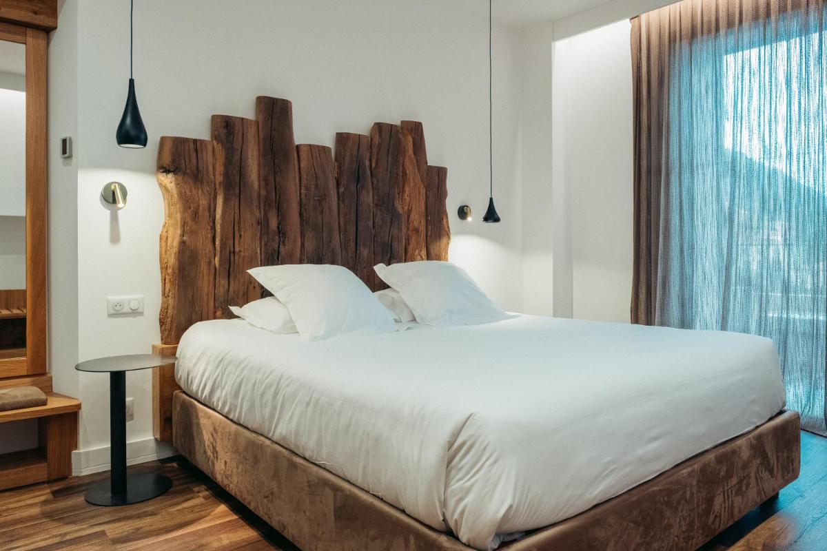 Un ou plusieurs lits dans un hébergement de l'établissement Hôtel Casale Olmia