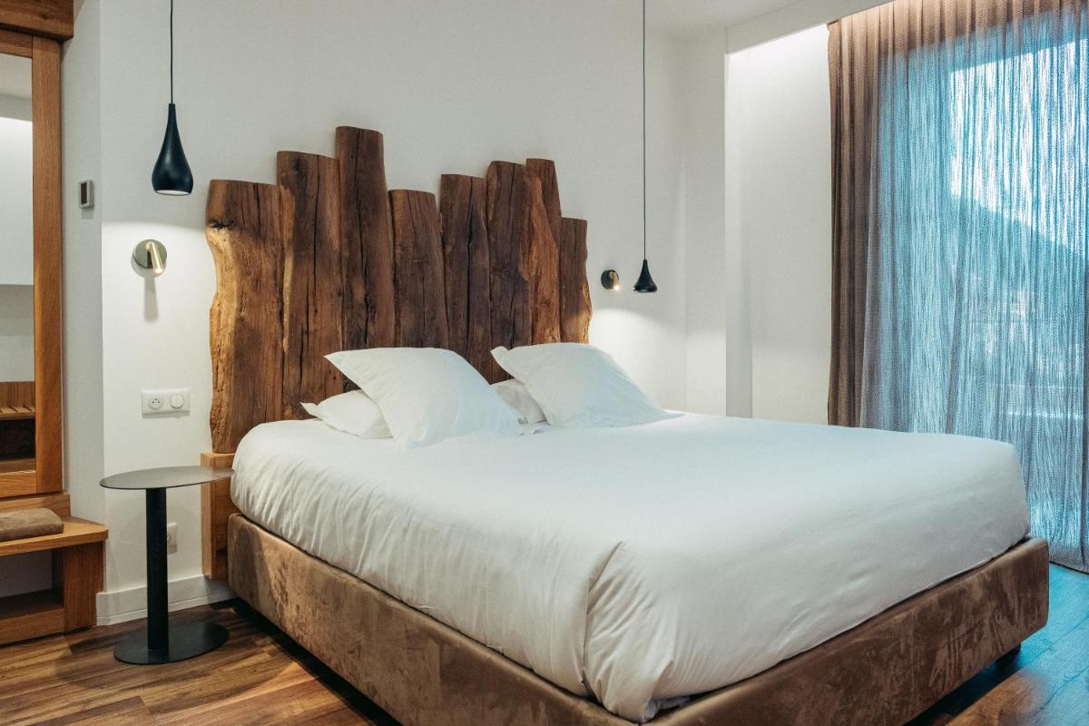 Un ou plusieurs lits dans un hébergement de l'établissement Hôtel Casale Olmia