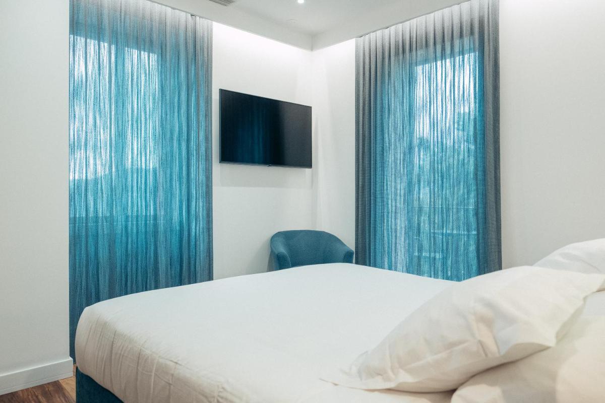 Un ou plusieurs lits dans un hébergement de l'établissement Hôtel Casale Olmia