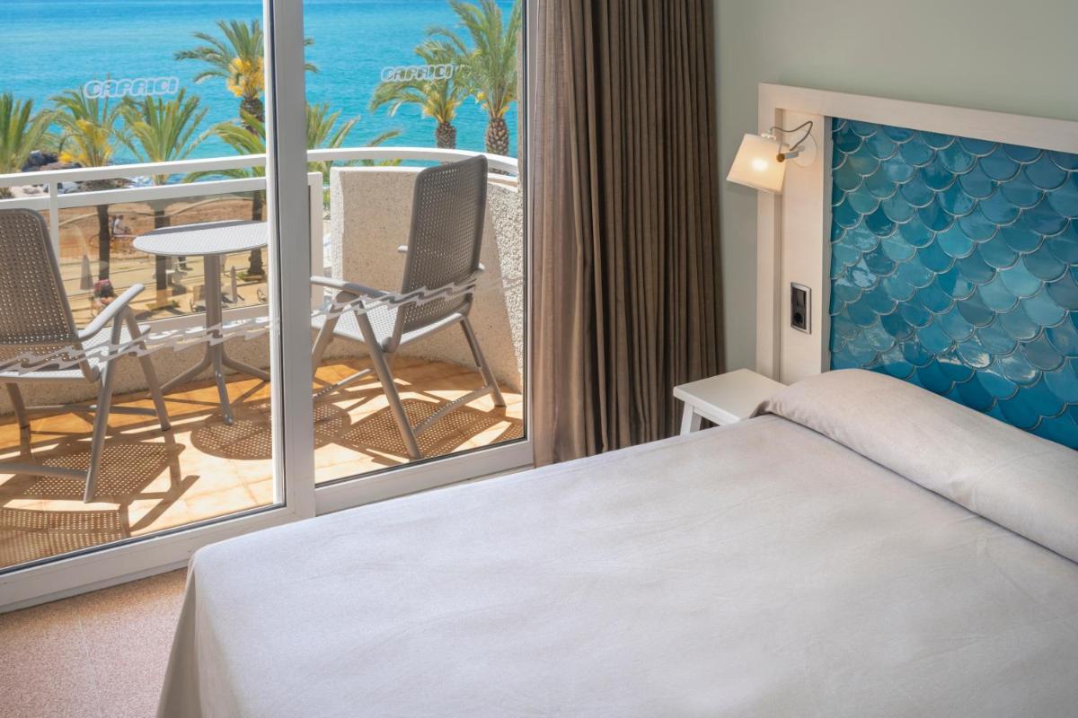 Cama o camas de una habitación en Caprici Beach Hotel & Spa