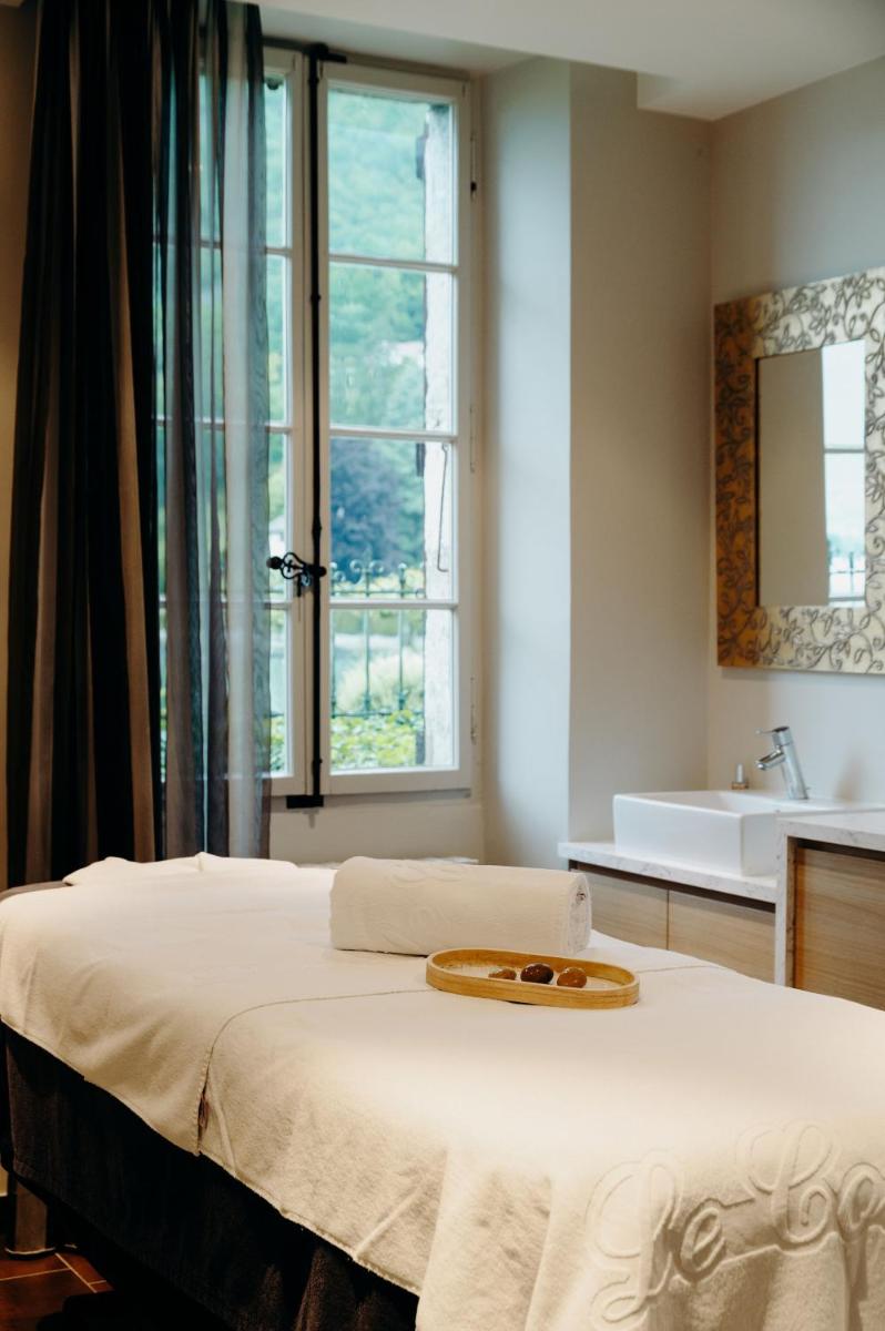 Un ou plusieurs lits dans un hébergement de l'établissement Hotel Le Cottage Bise
