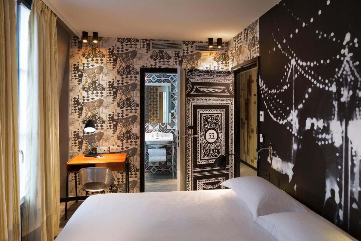 Un ou plusieurs lits dans un hébergement de l'établissement Hotel L’Antoine