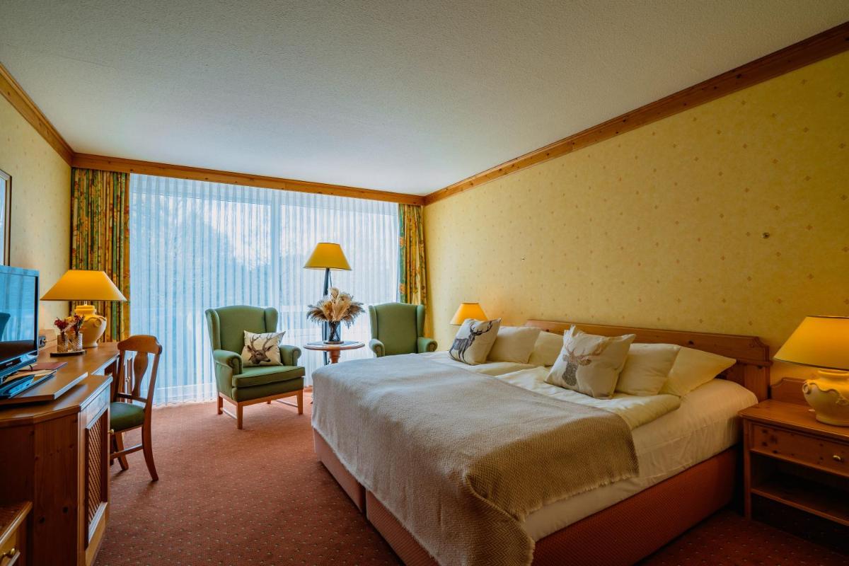 Ein Bett oder Betten in einem Zimmer der Unterkunft revita - naturresort & spa