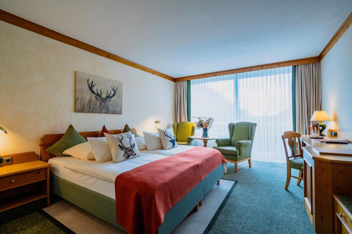 Ein Bett oder Betten in einem Zimmer der Unterkunft revita - naturresort & spa