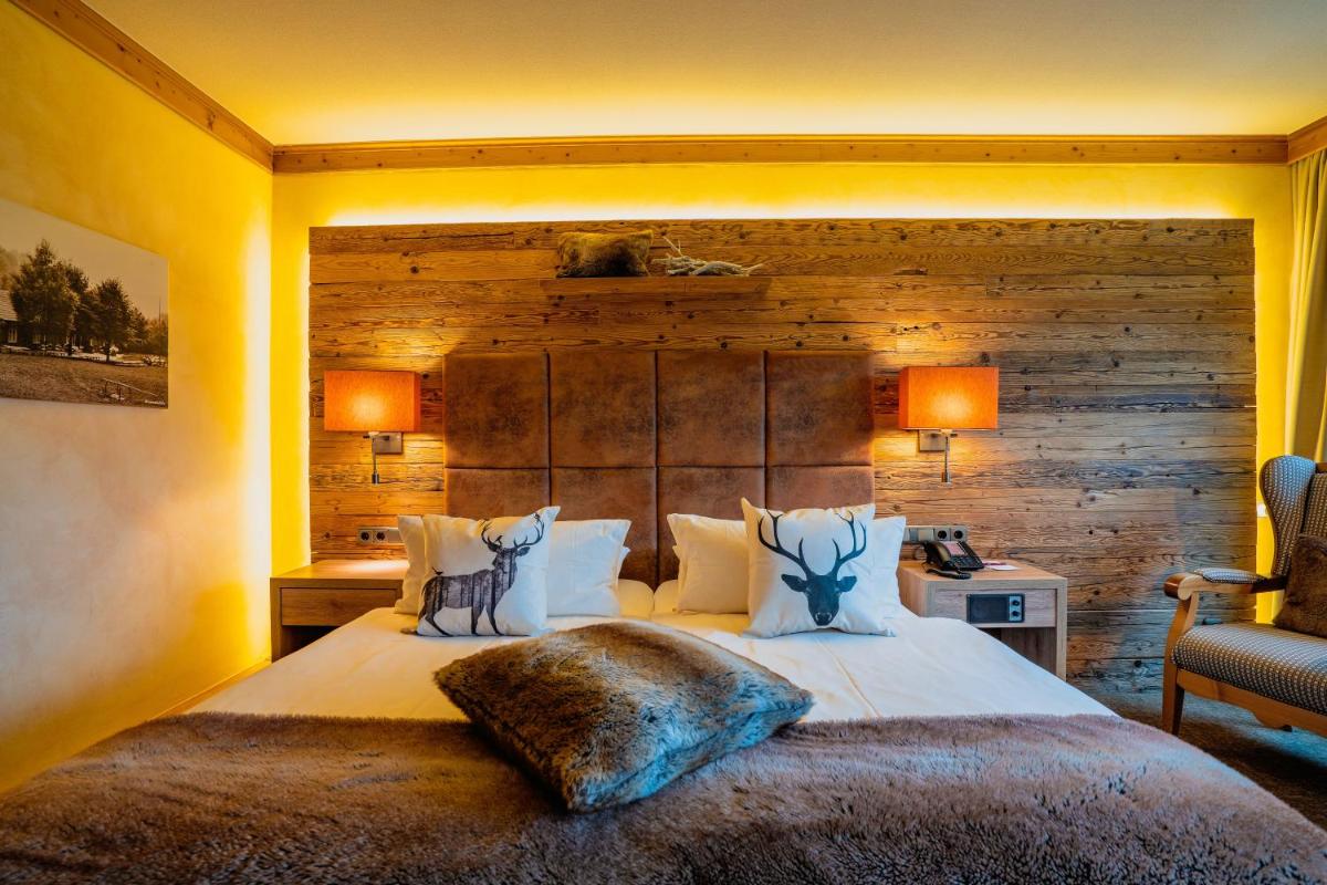 Ein Bett oder Betten in einem Zimmer der Unterkunft revita - naturresort & spa