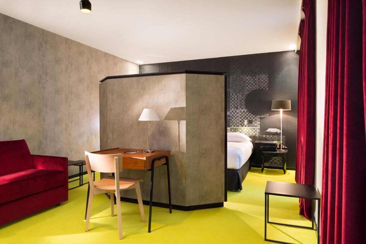 Coin salon dans l'établissement Hotel L’Antoine