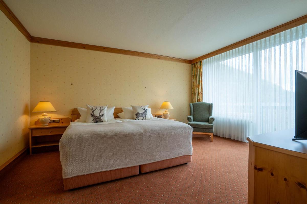 Ein Bett oder Betten in einem Zimmer der Unterkunft revita - naturresort & spa