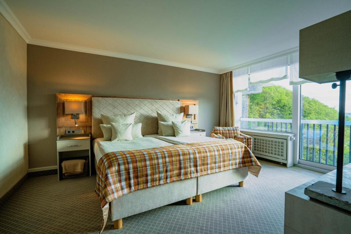 Ein Bett oder Betten in einem Zimmer der Unterkunft revita - naturresort & spa