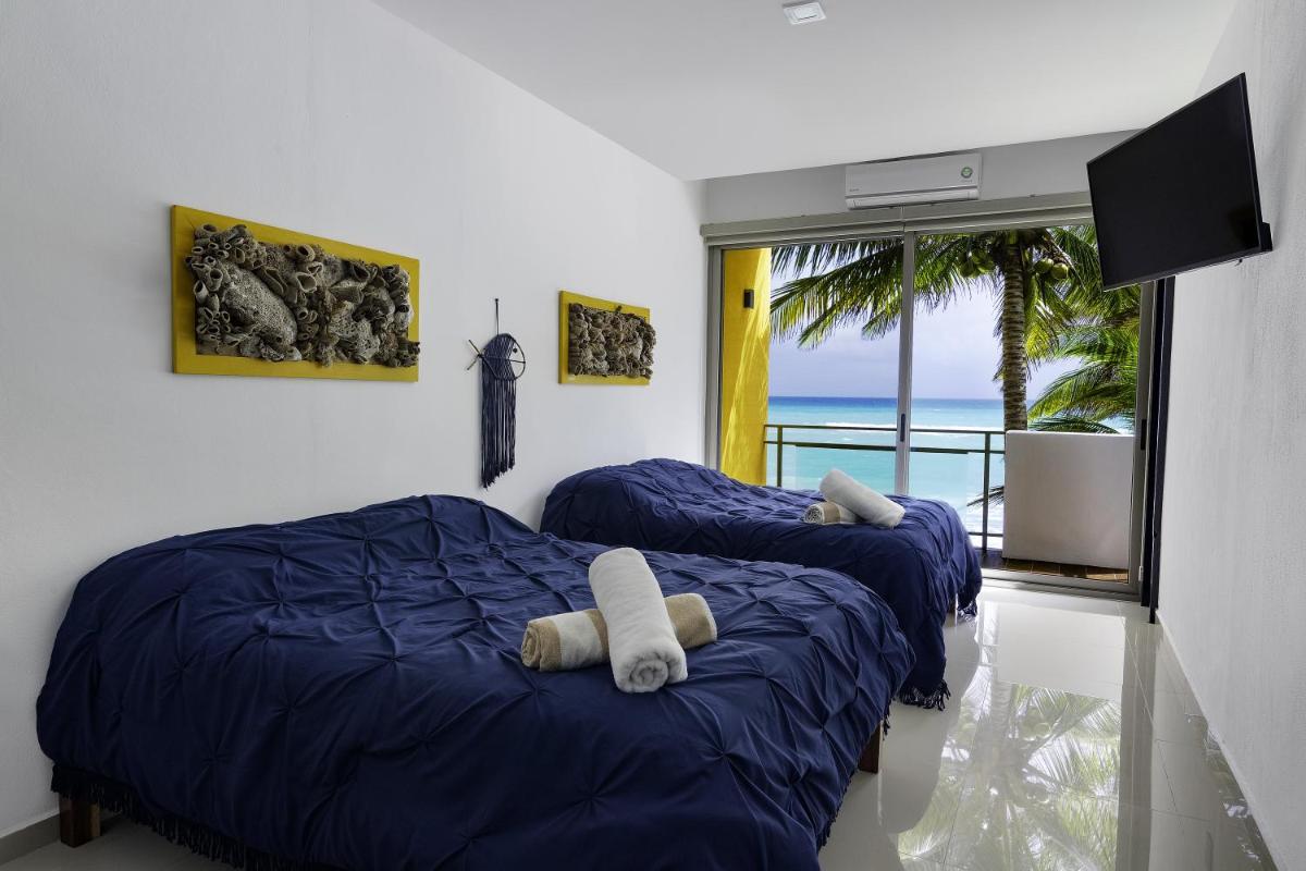 Angelina 28 Beachfront and Family Apartments - Modern and Relaxing Long Stays - 20 min from Cancun Airport - Housity
