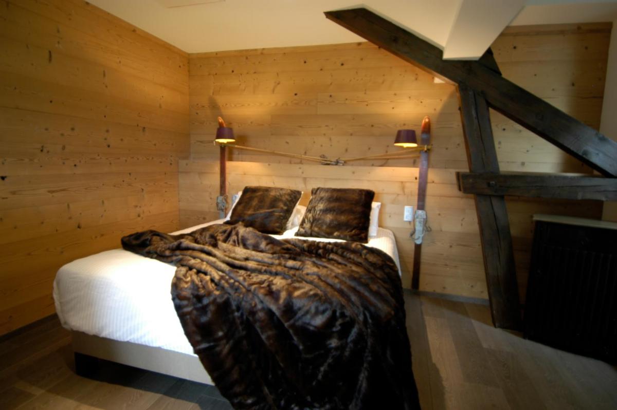 Un ou plusieurs lits dans un hébergement de l'établissement Auberge De Maison Rouge