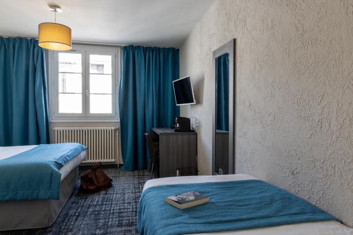 Un ou plusieurs lits dans un hébergement de l'établissement Hôtel Fesch & Spa