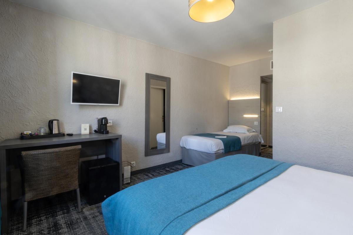 Un ou plusieurs lits dans un hébergement de l'établissement Hôtel Fesch & Spa
