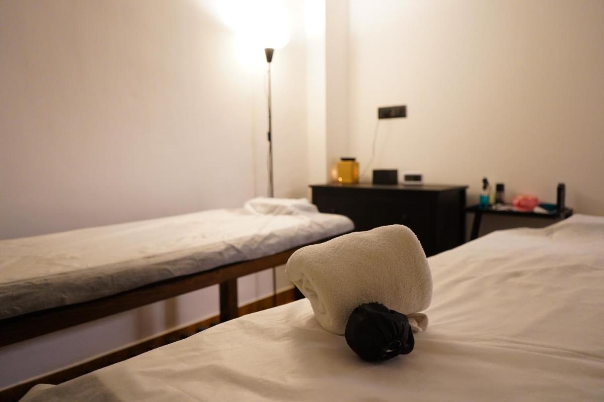 a room with two beds and a hat on the bed at Hilton Garden Inn Pune Hinjawadi in Pune