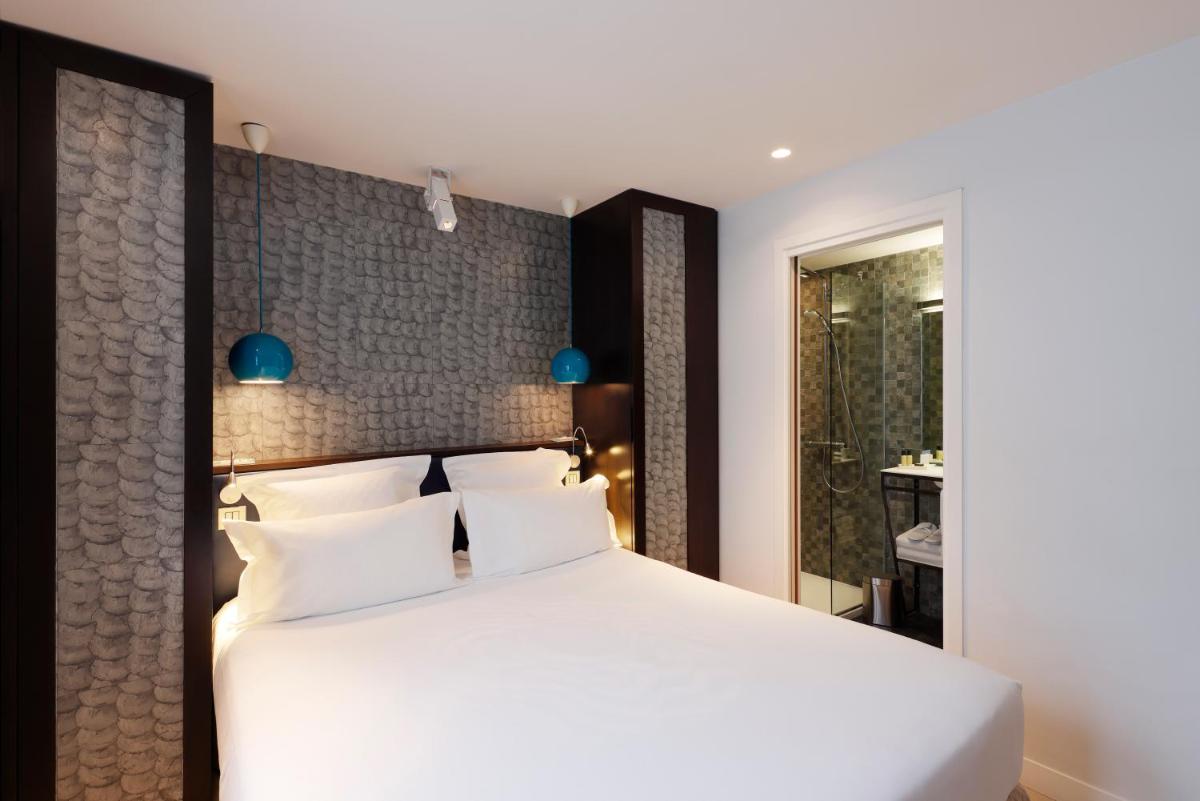 Un ou plusieurs lits dans un hébergement de l'établissement Hotel Eden