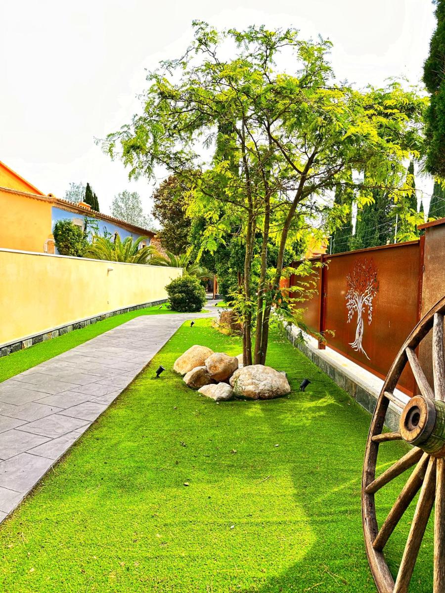 Jardín al aire libre en Boutique Hotel Comtal Empuries