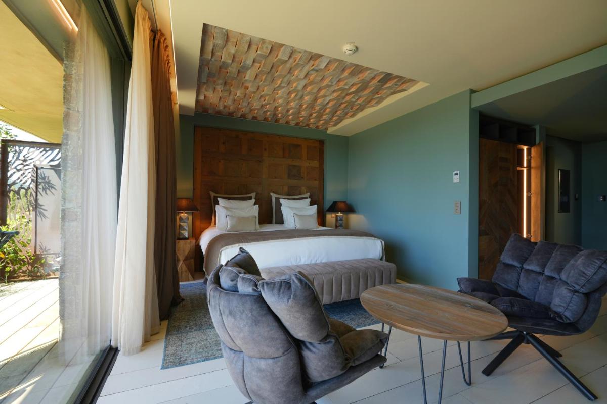 Coin salon dans l'établissement Les Regalia Hôtel & Spa
