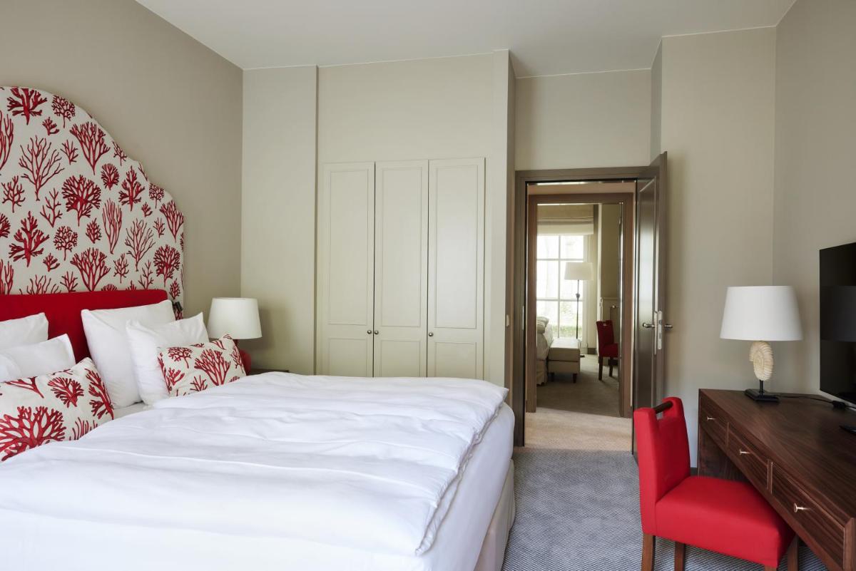 Ein Bett oder Betten in einem Zimmer der Unterkunft Strandhotel Zingst