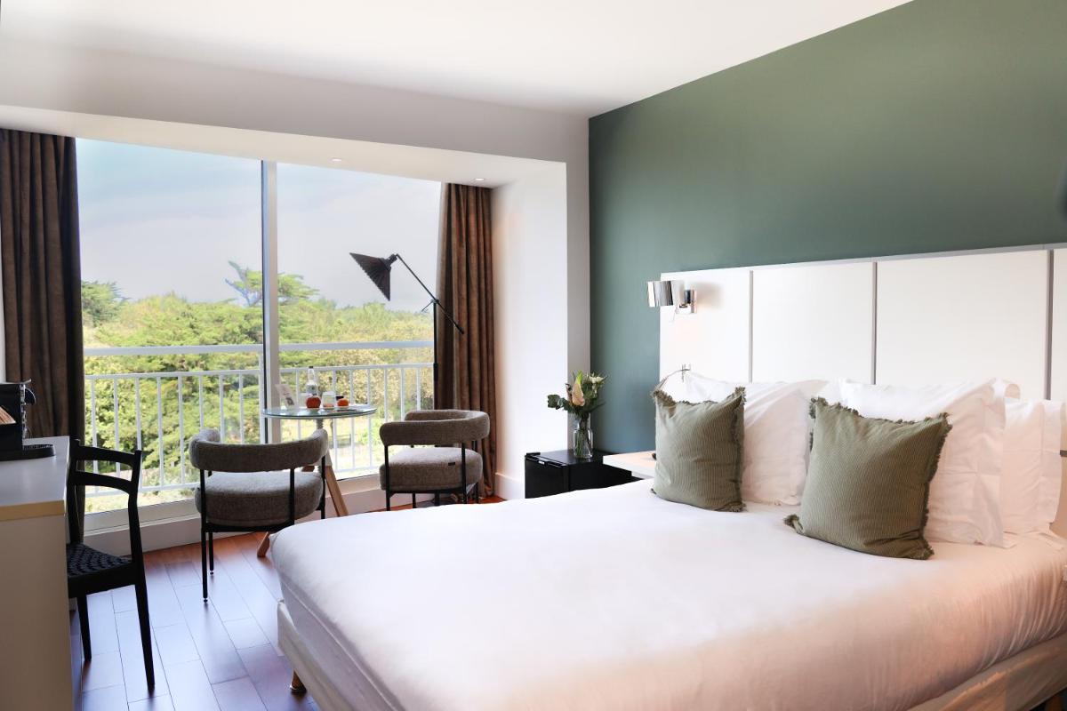 Un ou plusieurs lits dans un hébergement de l'établissement Hôtel & Spa Le Grand Large