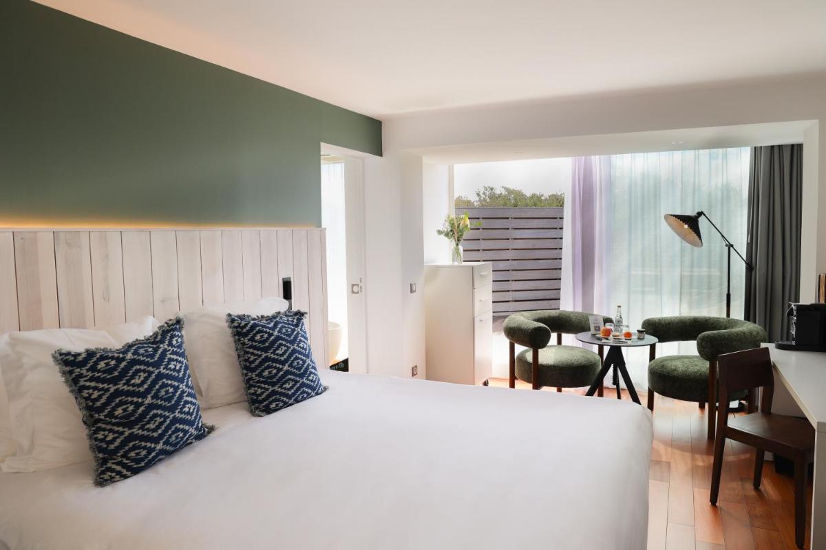 Un ou plusieurs lits dans un hébergement de l'établissement Hôtel & Spa Le Grand Large