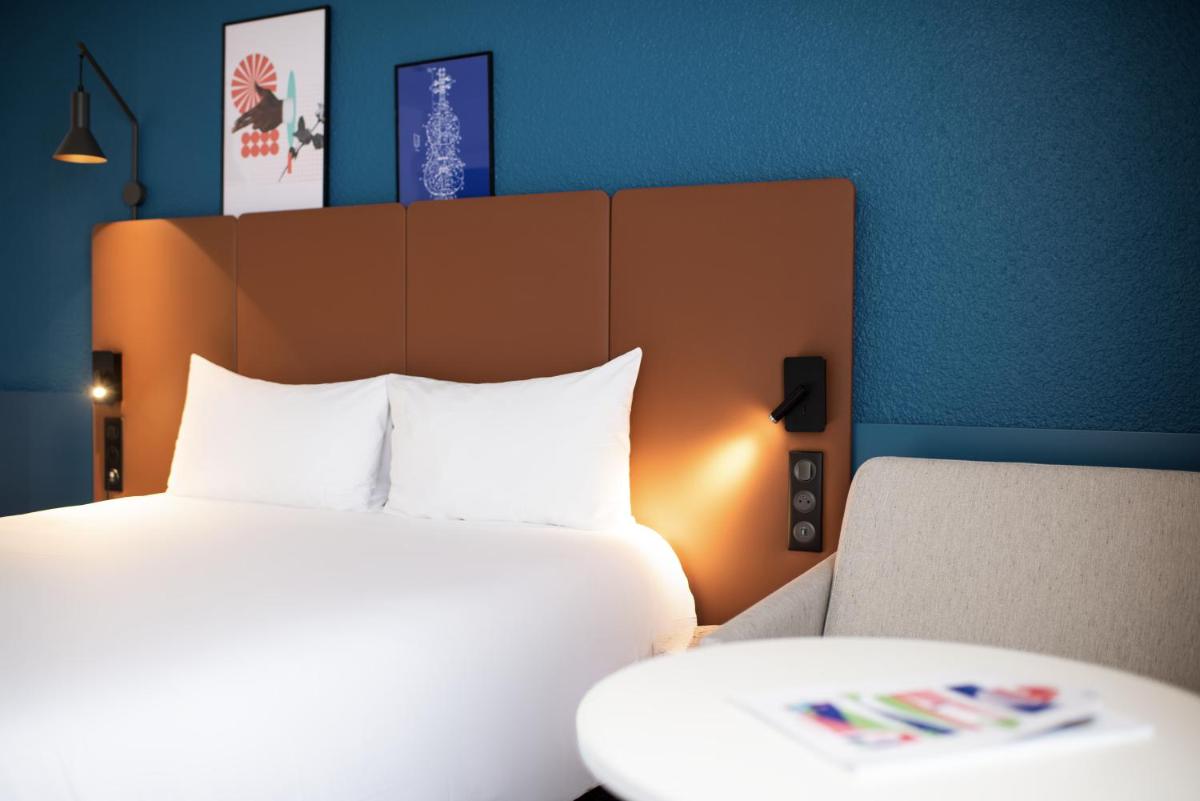 Un ou plusieurs lits dans un hébergement de l'établissement ibis La Baule Pornichet Plage