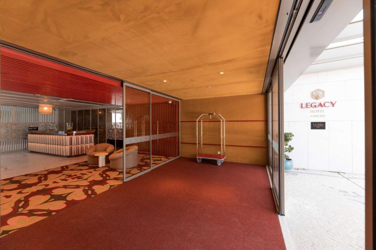 Uma cama ou camas num quarto em Legacy Hotel Cascais, Curio Collection By Hilton