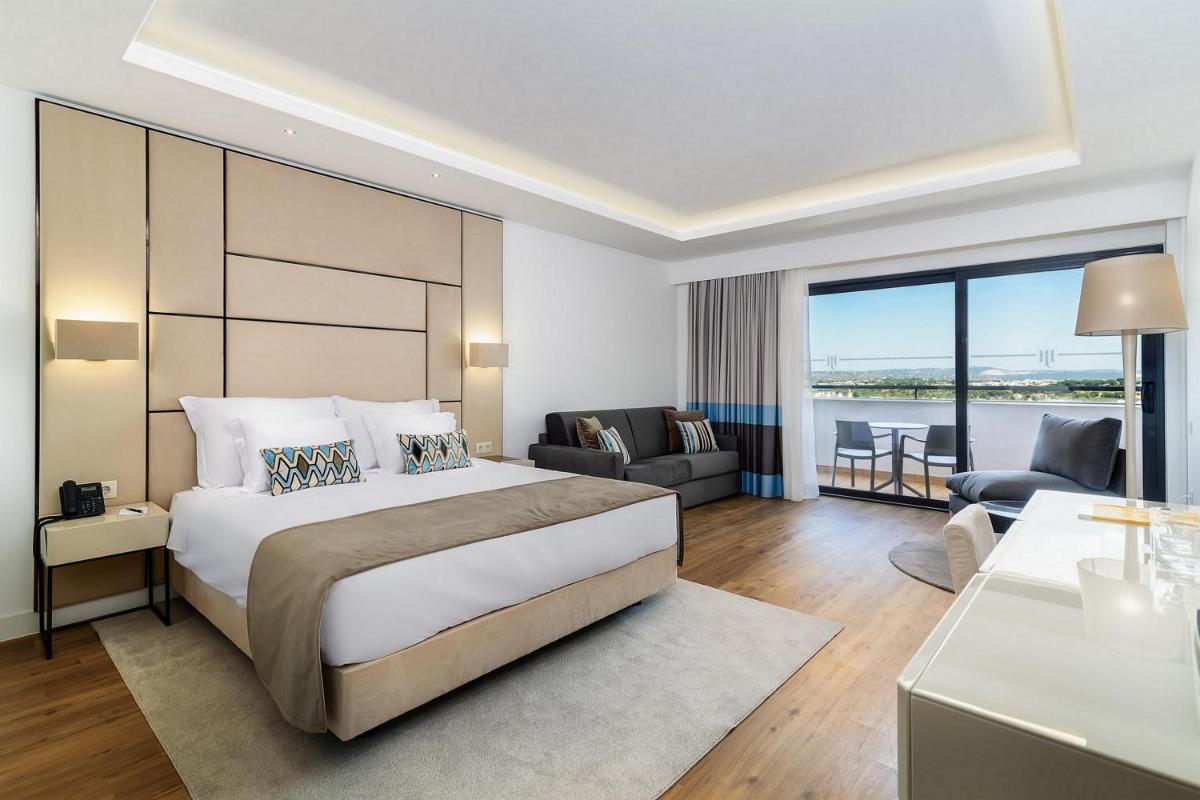 Uma cama ou camas num quarto em Jupiter Albufeira Hotel - Family & Fun - All Inclusive