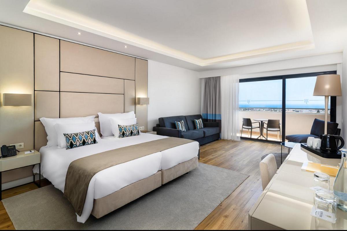 Uma cama ou camas num quarto em Jupiter Albufeira Hotel - Family & Fun - All Inclusive